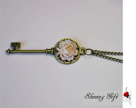 Antiqued Brass Key Necklace With Resin Rose By