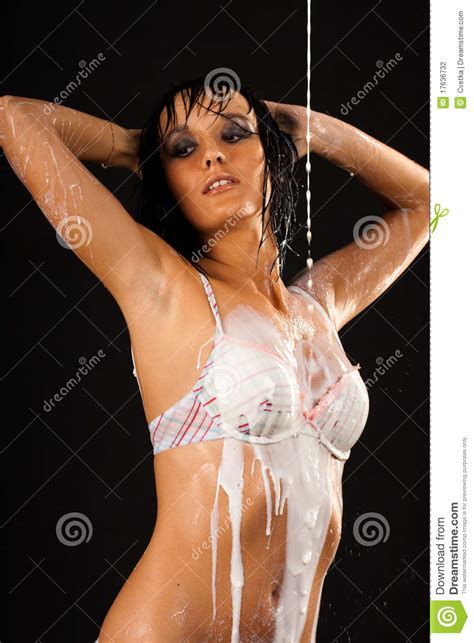Sexy Wet Girl In White Swimsuit With Milk Stock