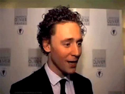 tom hiddleston laughing find and share on giphy