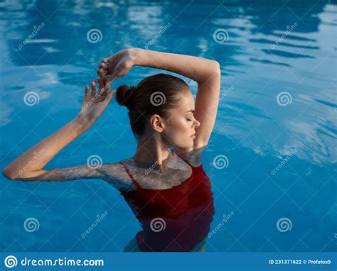 Woman In Red Swimsuit In The Pool Closed Eyes Rest Gesture With Hands