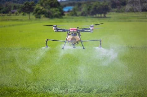 premium photo agriculture drones glide  rice fields spraying fertilizer farmers