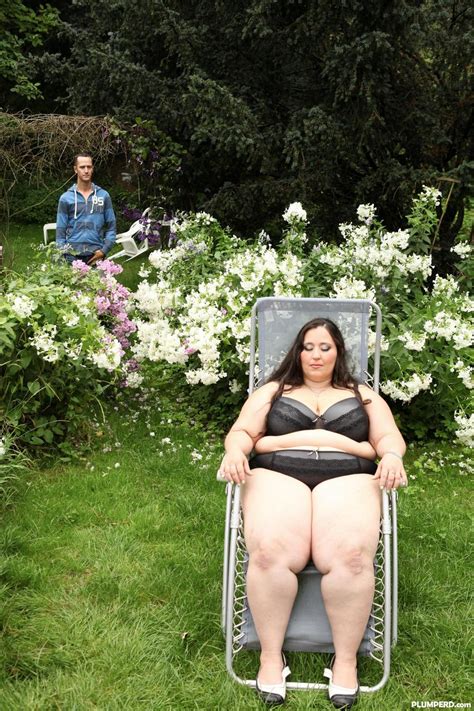 super sized bbw jitka sits on a peeping tom s face in the garden