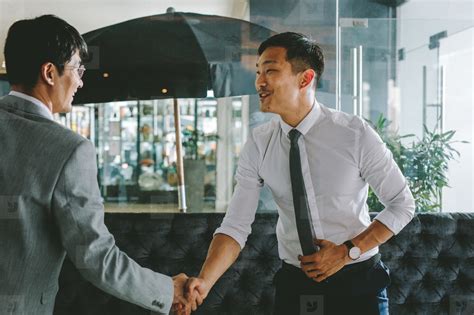 business people greeting     handshake stock photo