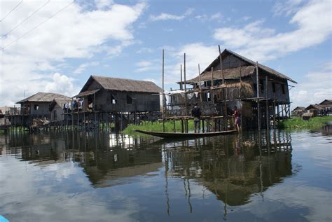 myanmar burma  kids lake inle part  houses  stilts  floating islands