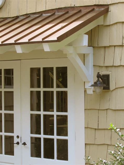 standing seam metal roof  rafters  brackets house exterior door overhang standing