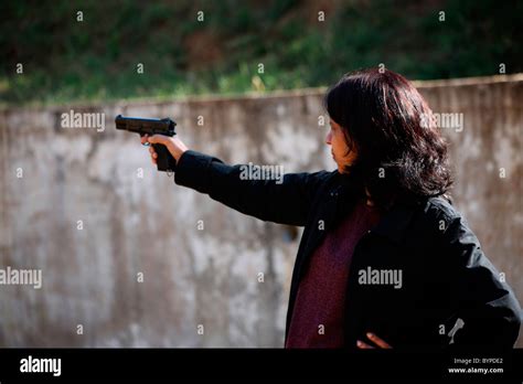shooting practice gun aim precision woman  res stock photography
