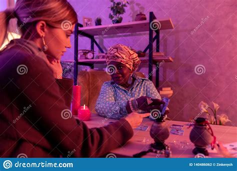 african american plump fortune teller with a huge ring