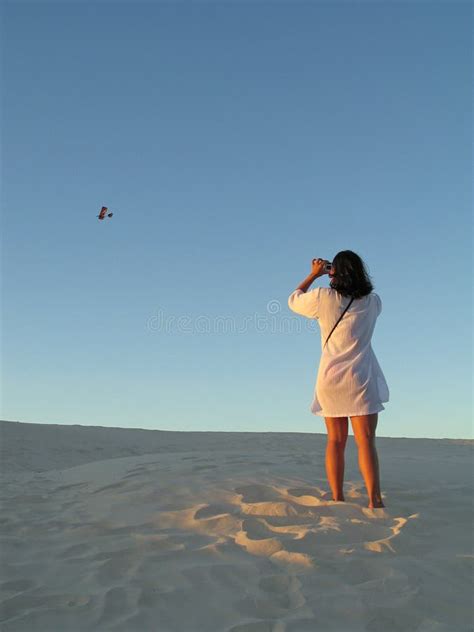 girl photographing stock photo image  beach dune photographer