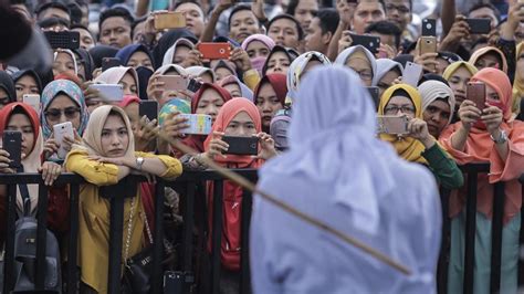 in indonesia couples caned in front of crowd for public shows of affection world news