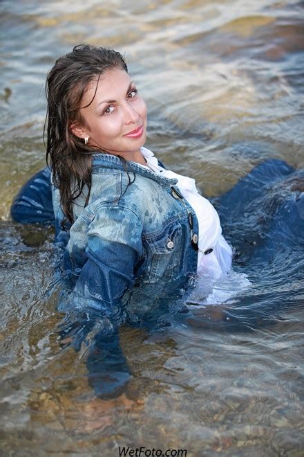fully clothed girl in tight jeans denim jacket and high heels get wet