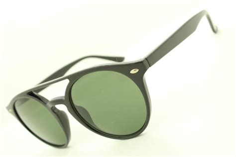 zonnebril met zwarte montuur en groene glas   bolcom