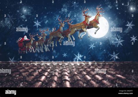 santa claus   sleigh pulled  reindeer flying  night
