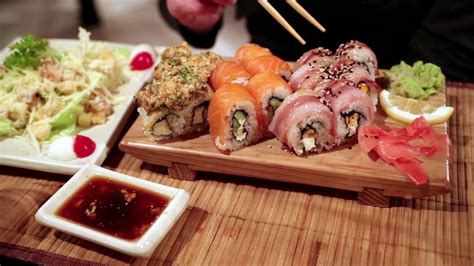 woman eating sushi   restaurant stock video footage storyblocks