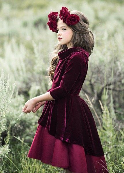 burgundy berries and rich evergreens come to mind when looking at this gorgeous occasion dress