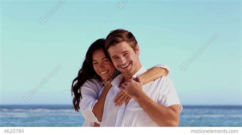 romantic couple smiling   camera