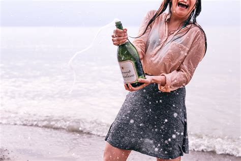 picture  woman popping champagne  stock photo