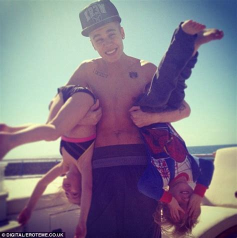justin bieber shows his softer side as he tucks his little brother into bed during beach holiday