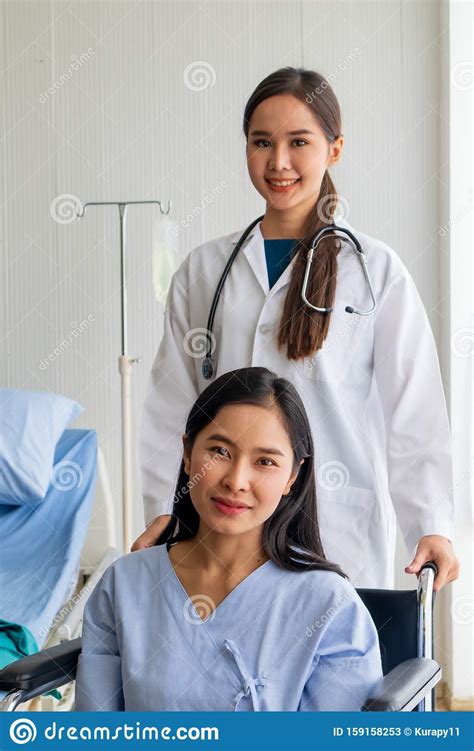 Asian Female Doctor Cheered On A Female Patient In A