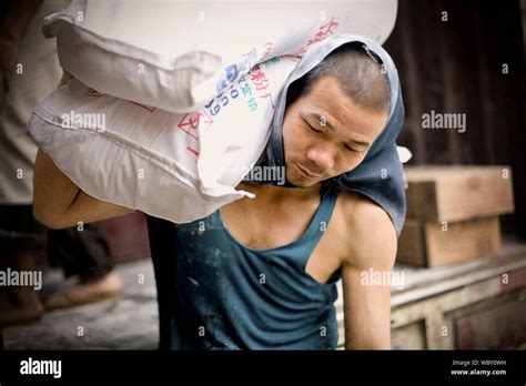 men carrying sacks  res stock photography  images alamy