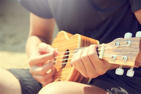 person playing ukulele  stock photo