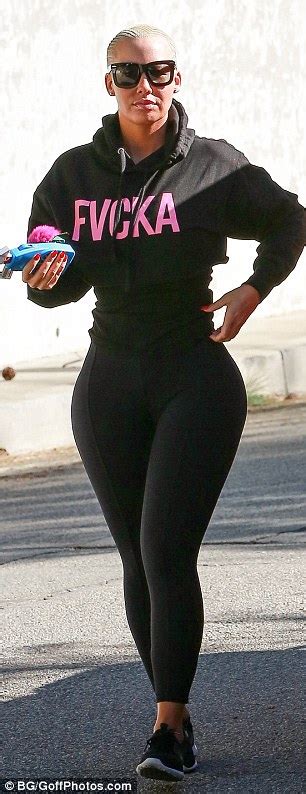 amber rose s butt pads can be seen under her tight leggings daily