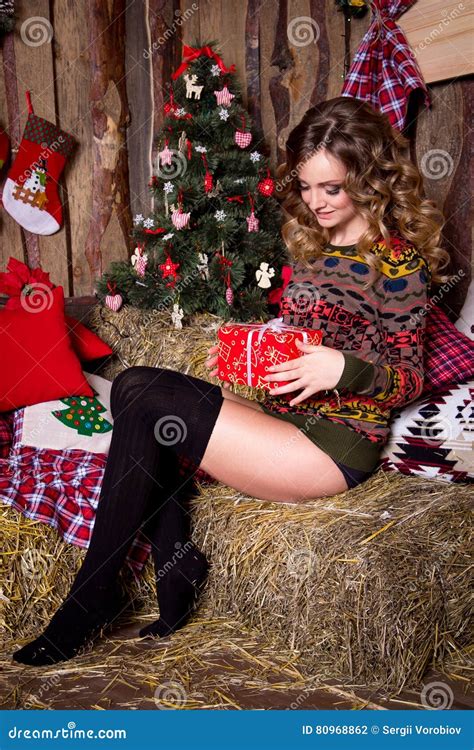 sexy smiling girl near christmas tree royalty free stock image