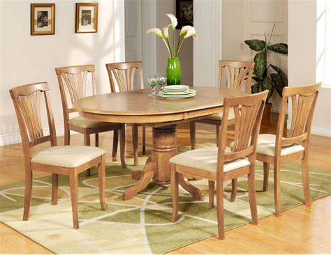 pc avon oval dining table   upholstered chairs  oak finish