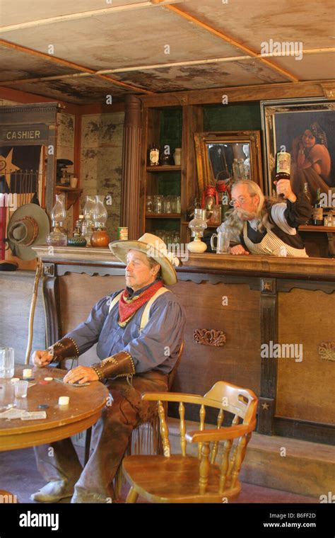 west saloon  cowboy     hit   head  stock photo royalty