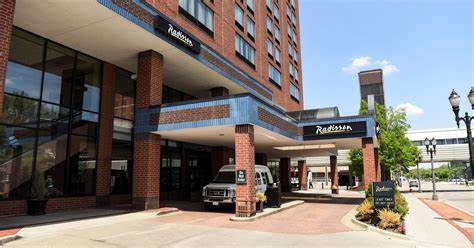 company sues lansing  parking spots  downtown radisson hotel