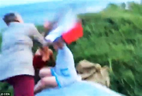 russian mum and grandmother are beaten up by passers by in video daily mail online