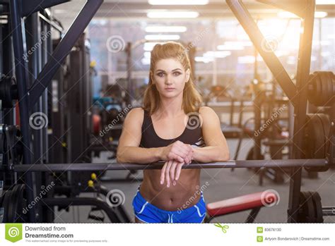 Sporty Woman Doing Power Fitness Exercise At Sport Gym Beautiful Girl