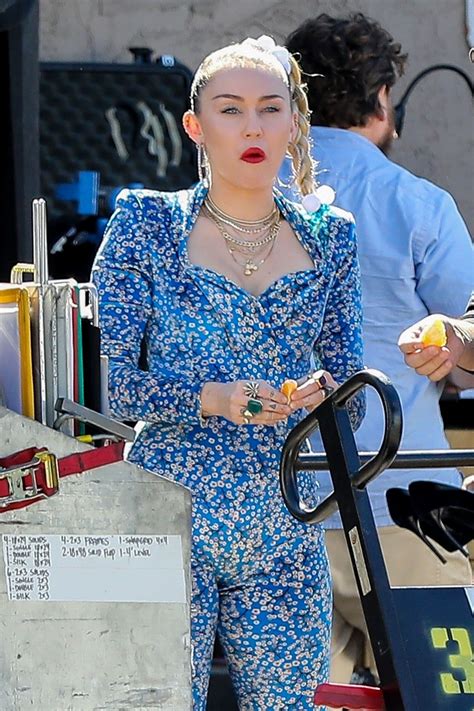 miley cyrus in a blue floral jumpsuit on set of her latest project in la 10 18 2018