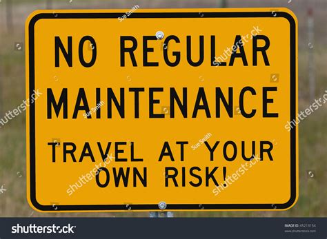 regular maintenance travel    risk sign   maintained road stock photo