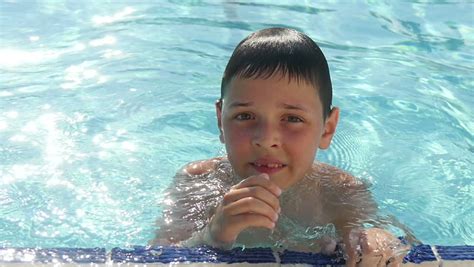 pre teen girl going underwater in the pool stock footage