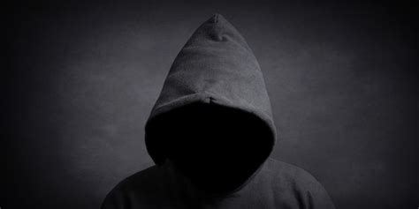 faceless person wearing black hoodie hiding face  shadow nuernberger blatt