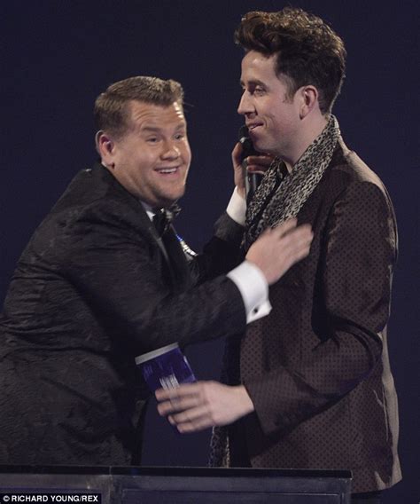 nick grimshaw and host james corden share a kiss at brit awards daily mail online