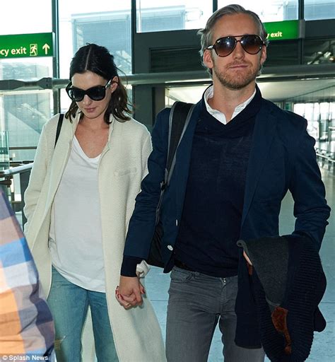 anne hathaway goes make up free at lax with husband adam