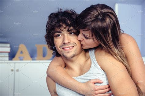 Beautiful Woman Kissing And Embracing To Happy Man People Images