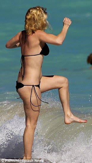 Alice Eve Very Nearly Spills Out Of Her Black Bikini On