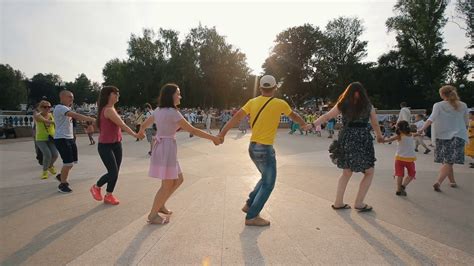 people dancing  circle holding hands stock footage sbv