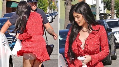 Kylie Jenner Flashes Her Spanx As A Gust Of Wind Lifts Up Her Tiny Red