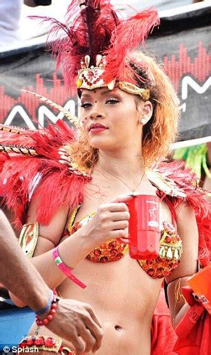 rihanna goes back to her rude girl ways getting raunchy as a scantily clad carnival queen