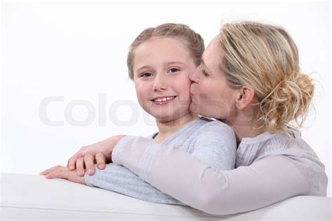 Mother Kissing Her Daughter Stock Image Colourbox