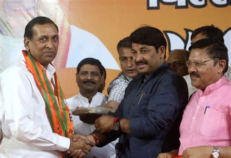 ahead of polling ex delhi minister chauhan joins bjp