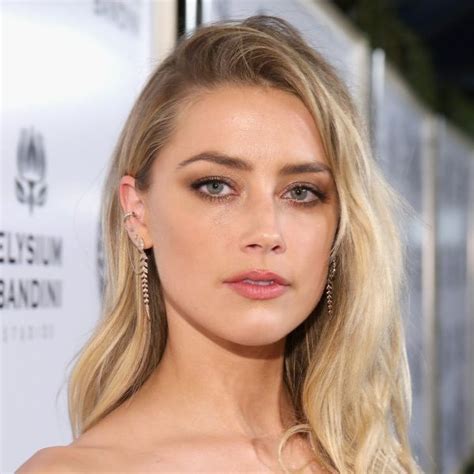 amber heard says her new film s risqué scenes were filmed without her