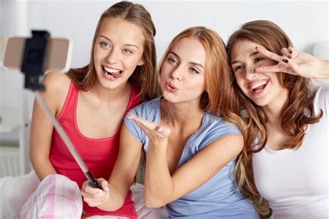 Teen Girls With Smartphone Taking Selfie At Home Stock