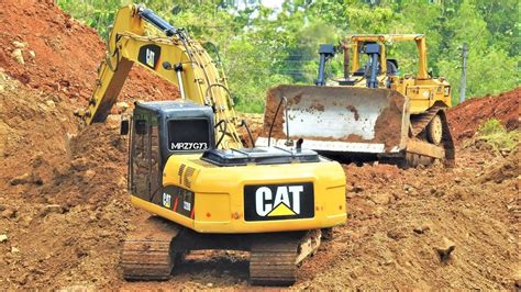 construction equipment excavator bulldozer working building  road