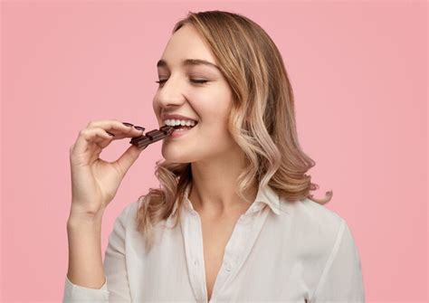 Premium Photo Young Woman Enjoying Sweet Chocolate