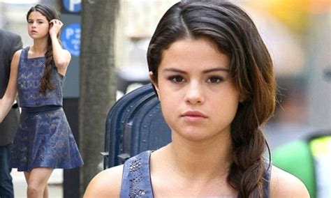 selena gomez shows off her toned pins and taut tum in a cute blue mini and matching crop top as