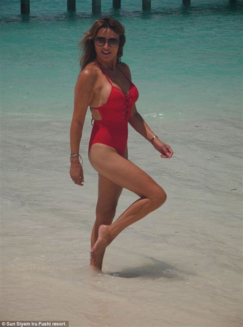 lizzie cundy shows off her sizzling frame in a sexy red swimsuit daily mail online
